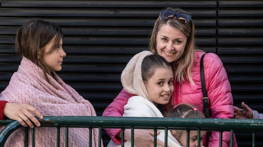 Refugees from Ukraine wait to be registered at UNHCR's cash enrolment centre