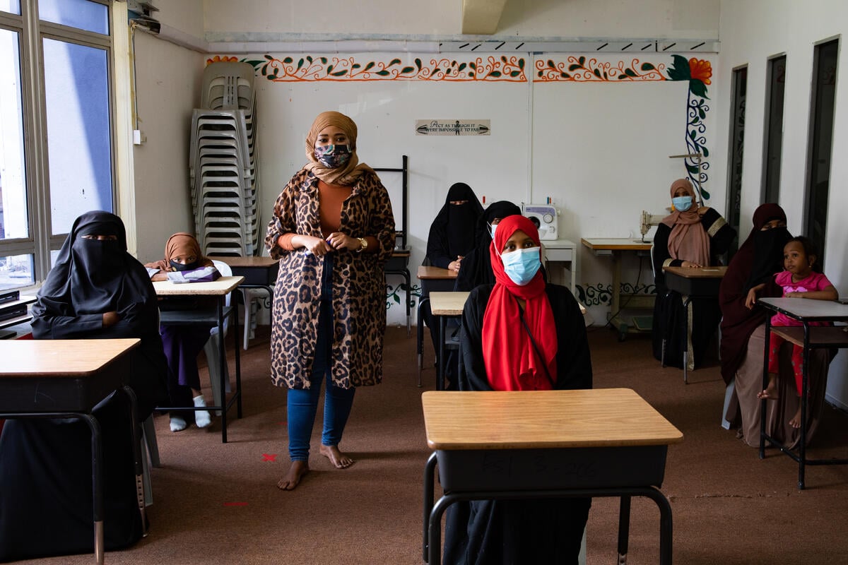 Malaysia. A refugee leader from Somalia teaches an English class for Somali women