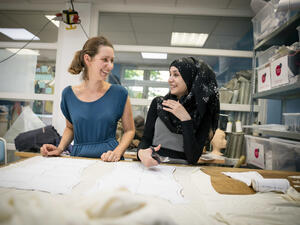 Germany. Refugee women got a job as a seamstress in a Frankfurt fashion workshop.