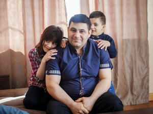 Belarus. A Syrian refugee and his children spend Sunday together in their new home in Gomel