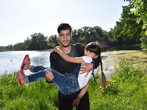 Refugee from Syria hugs his sister in Lensahn, northern Germany