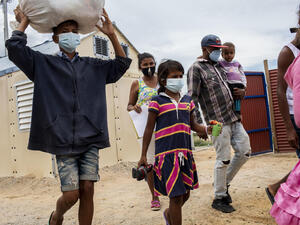 A family of Venezuelan refugees arrives on 6 October, 2020, at an assistance centre in the border town of Maicao, in northern Colombia.