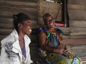 Two refugee women laughing