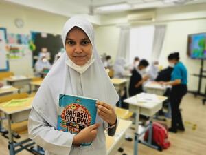 Onaisah in her classroom at a learning centre run by UNHCR's NGO partner, Buddhist Tzu Chi Foundation.