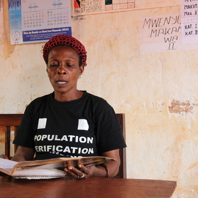 Mwavita Mlasi, in the office of the Executive Committee at Nyarugusu Refugee Camp, uses her position as vice president to help people find solutions to their problems.