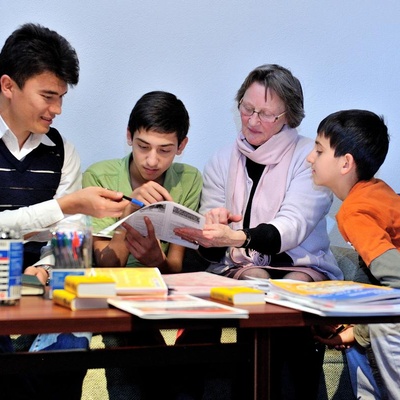Austria. Shokat Ali who arrived in Austria in 2008 helping a family of recent arrivals from Afghanistan. Seen here with the family's host.