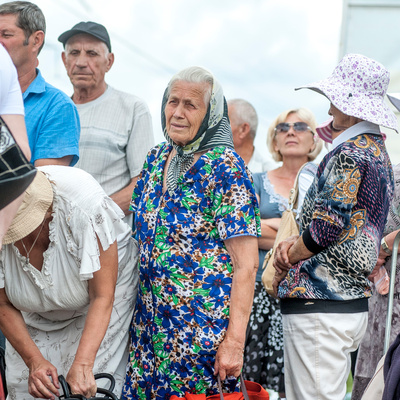 People queue at a checkpoint in Marinka, close to the conflict zone in eastern Ukraine, July 2016.