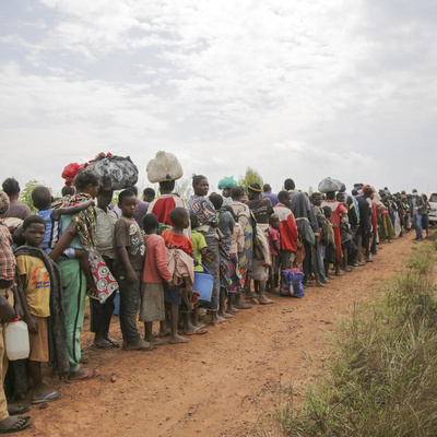 Congolese asylum-seekers await health screening in Zombo, near the border between Uganda and the Democratic Republic of Congo in July 2020.