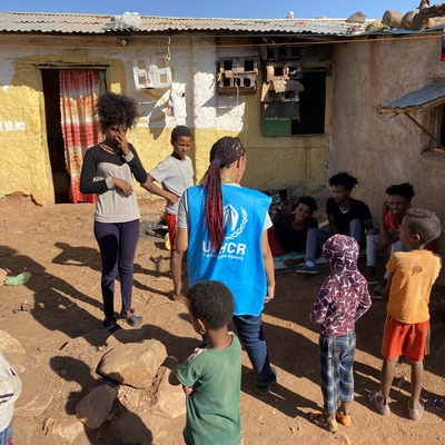 A UNHCR officer talks to refugees in Mai Aini refugee camp. The biggest concerns of the refugees are food, clean water, and the security situation in the camps. The refugees report almost nightly looting by armed gangs. 