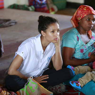 Uganda. UNHCR Supporter Gugu Mbatha-Raw at the Women's Centre in Nakivale Refugee Settlement, with Sifa Semeki, a refugee.