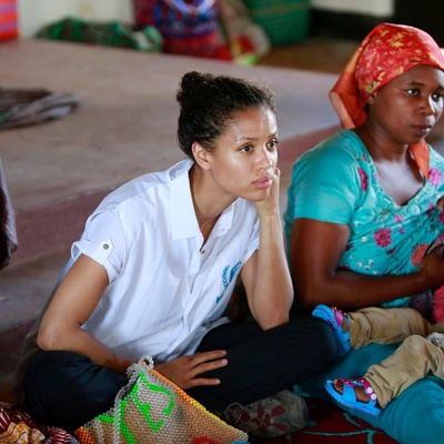 Uganda. UNHCR Supporter Gugu Mbatha-Raw at the Women's Centre in Nakivale Refugee Settlement, with Sifa Semeki, a refugee.