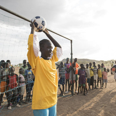 Kenya. Margaret Monday Dominic, 15 plays football with her friends and classmates
