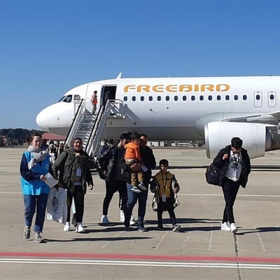 UNHCR, the UN Refugee Agency, and the International Organization for Migration (IOM) welcoming a group of 89 Syrian refugees at Torrejón military airport in Madrid.