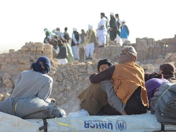 Families facing their destroyed houses while receiving tents and other emergency support from UNHCR Afghanistan after the recent earthquake