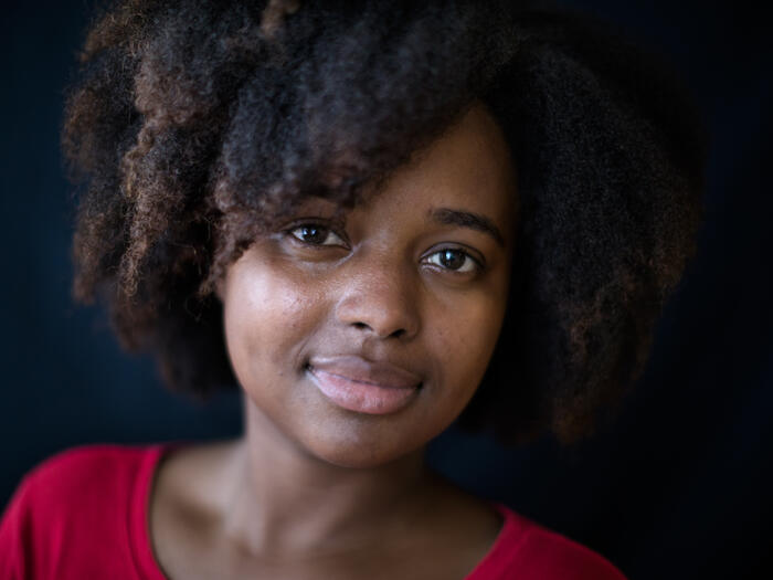 UNHCR, the UN Refugee Agency - Bahati Ernestine Hategekimana looks straight into the camera, hinting a smile. The 25-year old is studying nursing thanks to the DAFI scholarship she won in 2014. 