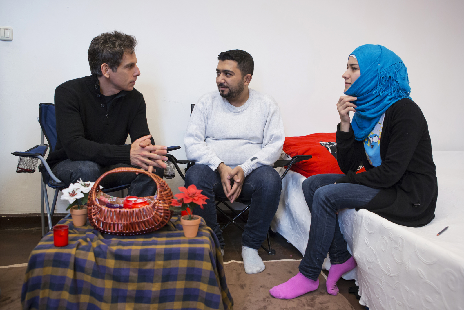 Germany. Actor Ben Stiller meets Nahed and her family at an emergency shelter in Berlin