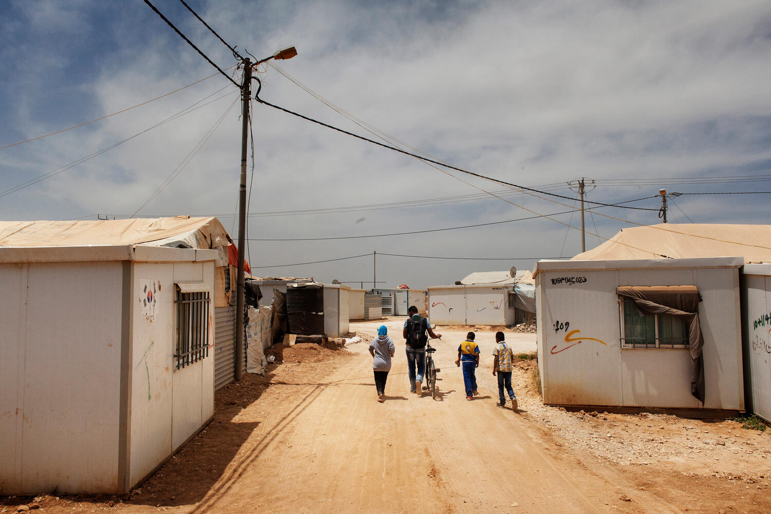 Jordan. 25-year-old Fadi Al Wali teaches origami to special needs children and other children at Za'atari refugee camp.