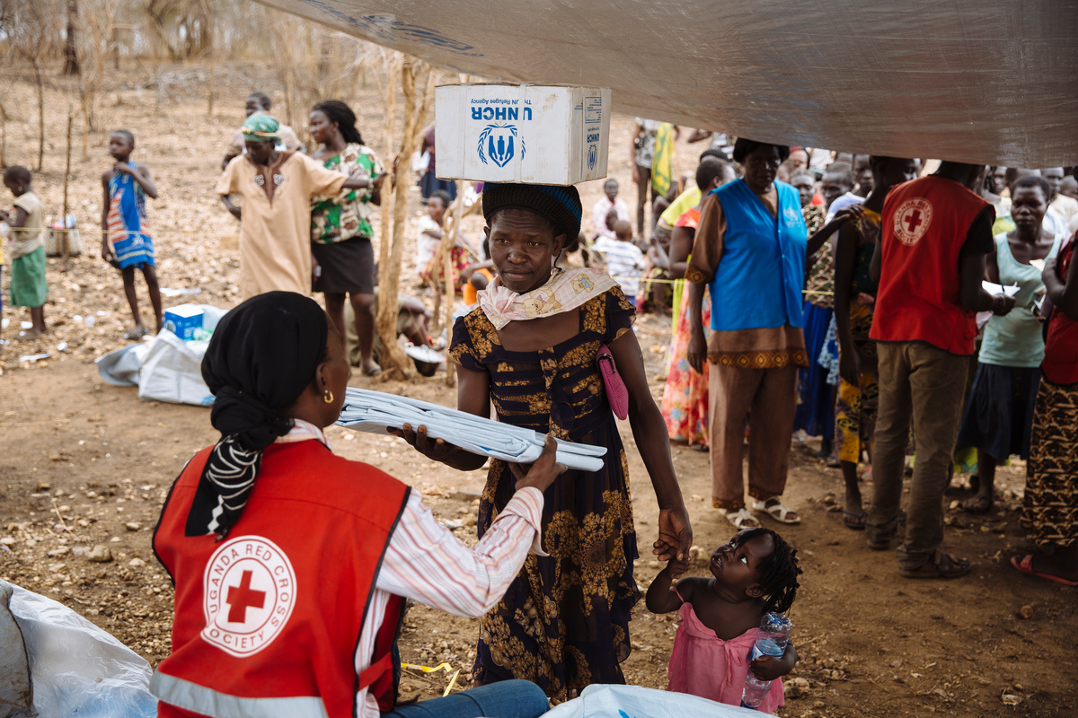 Uganda. South Sudanese refugee Opani Lilias receives Core Relief Items at Imvepi settlement