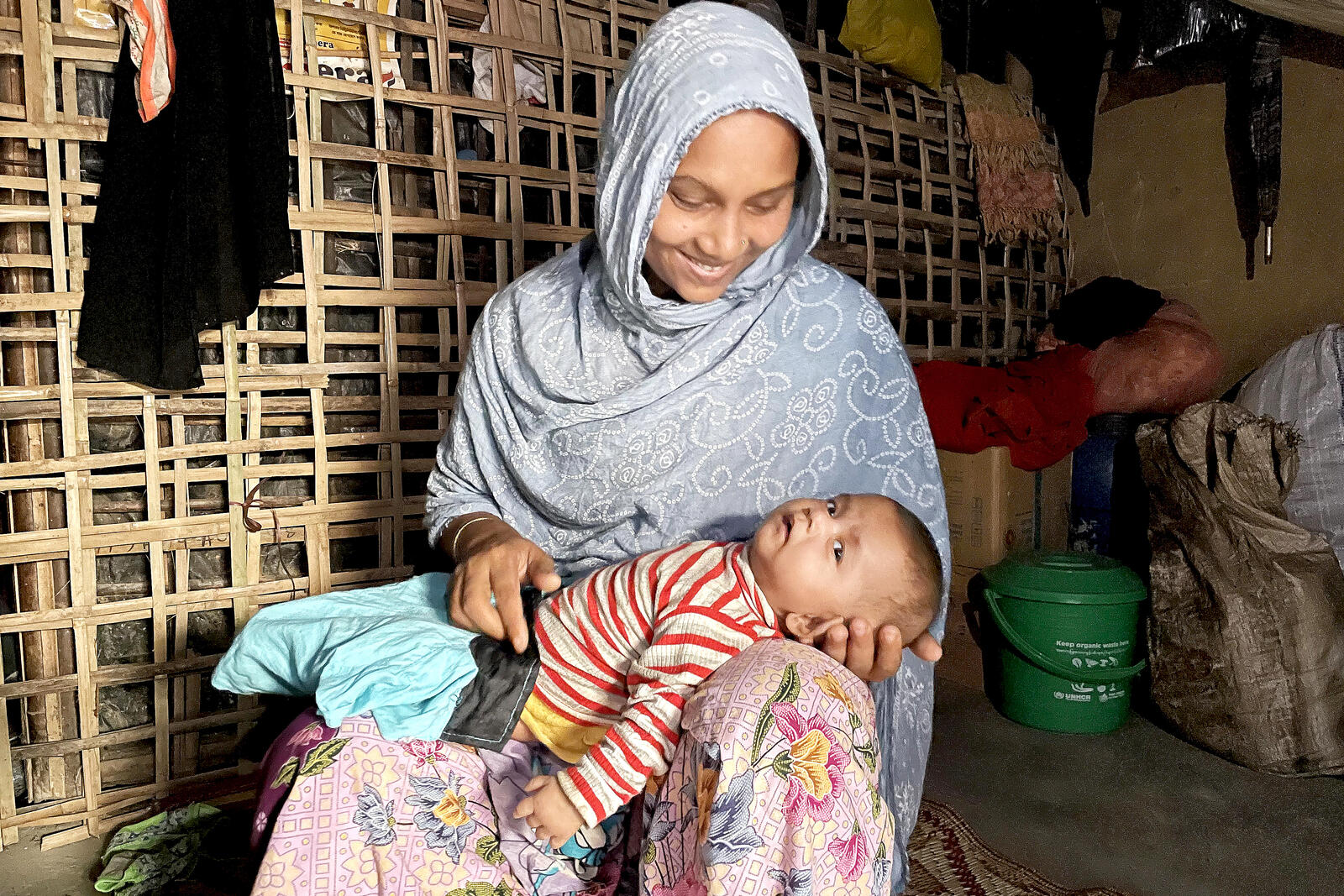 Bangladesh. Rohingya woman took shelter in her relative's home after losing everything in a recent fire at Kutupalong refugee settlement.