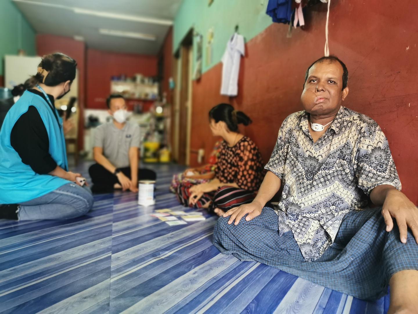 Mohamad Harun receives frequent visits from Buddhist Tzu Chi caseworkers who check on his condition and assist the family with any required needs.