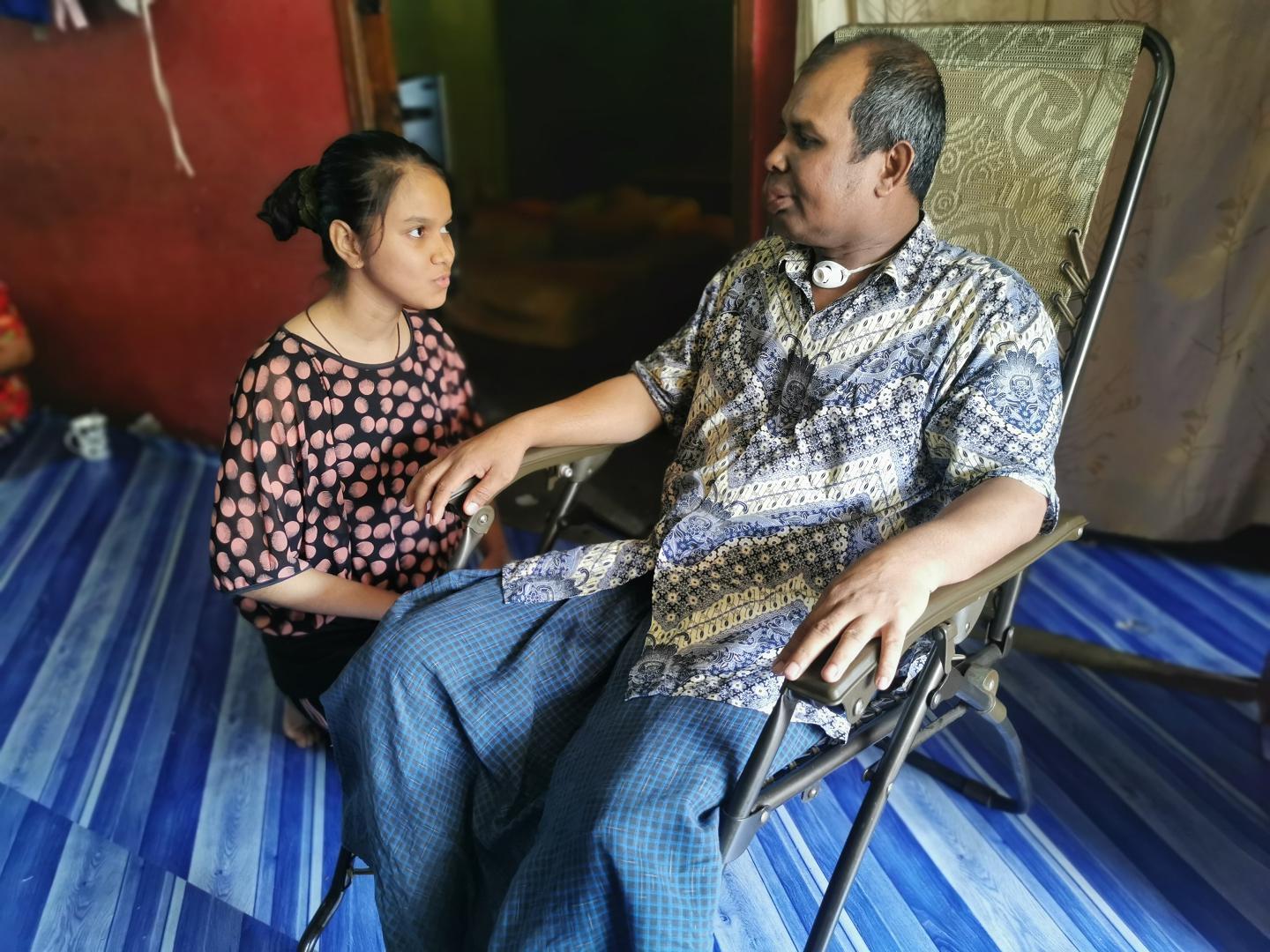 Onaisah and her father, Mohamad Harun at home.