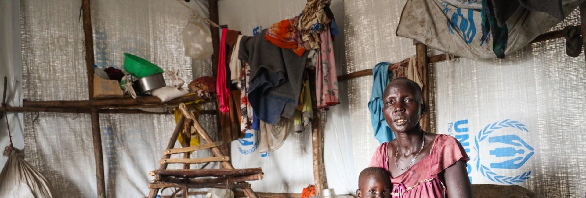South Sudanese refugee Chol Tut Deng takes a break with her youngest son.