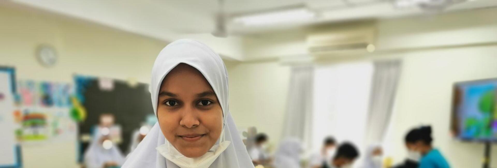 Onaisah in her classroom at a learning centre run by UNHCR's NGO partner, Buddhist Tzu Chi Foundation.