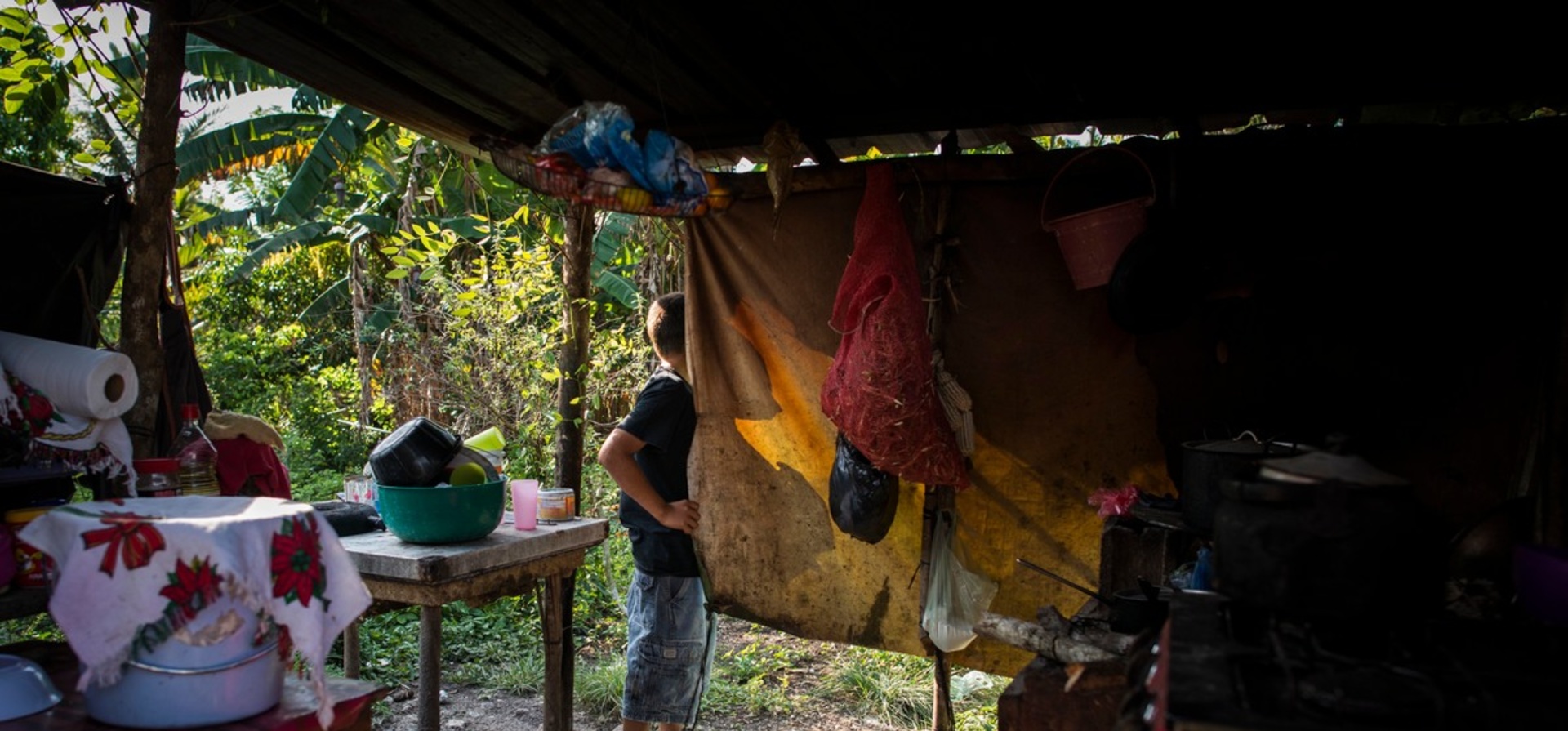 Belize. Daily life of family who fled from gangs violence of El Salvador.