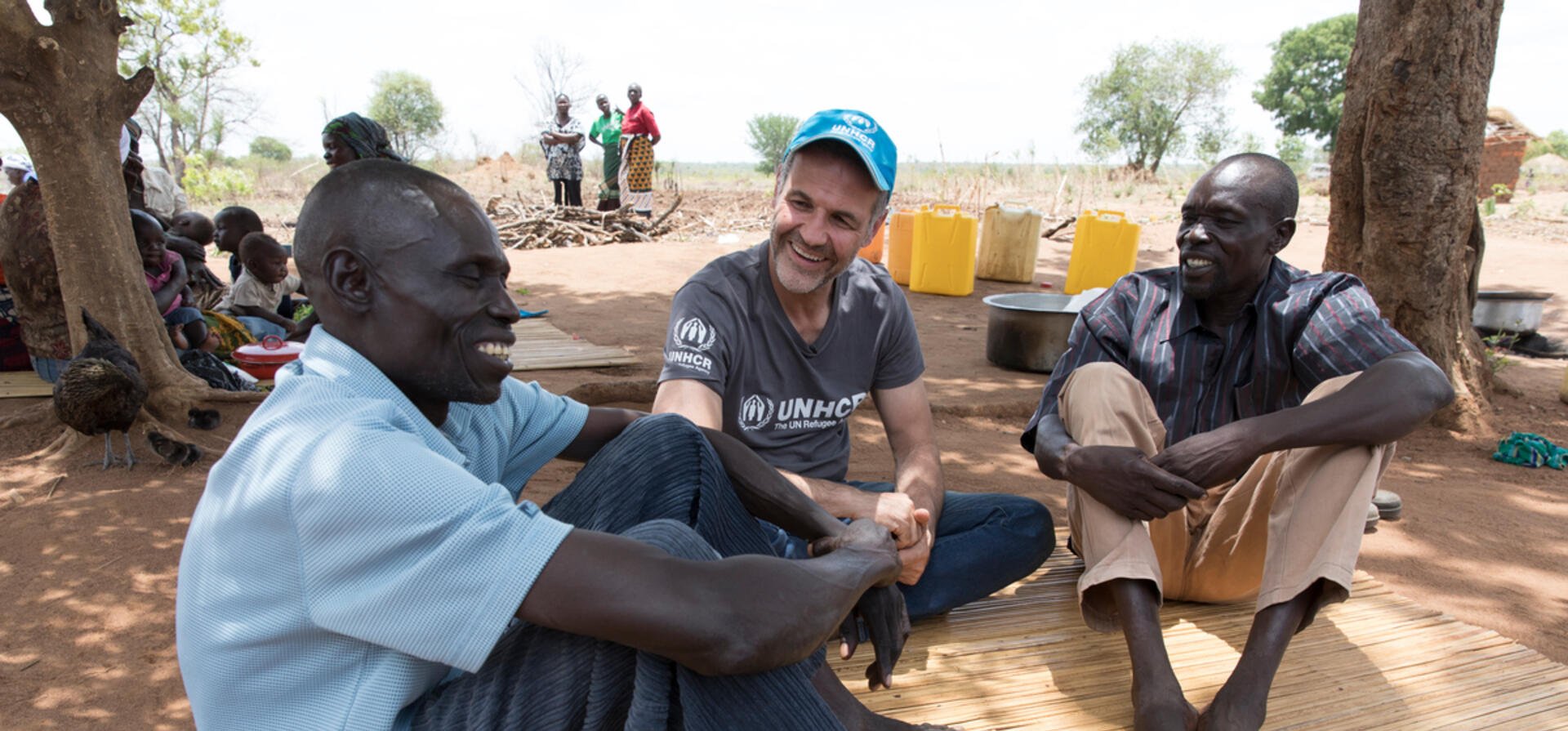 Uganda. UNHCR Goodwill Ambassador Khaled Hosseini with Yahaya and Mike at Bidibidi settlement