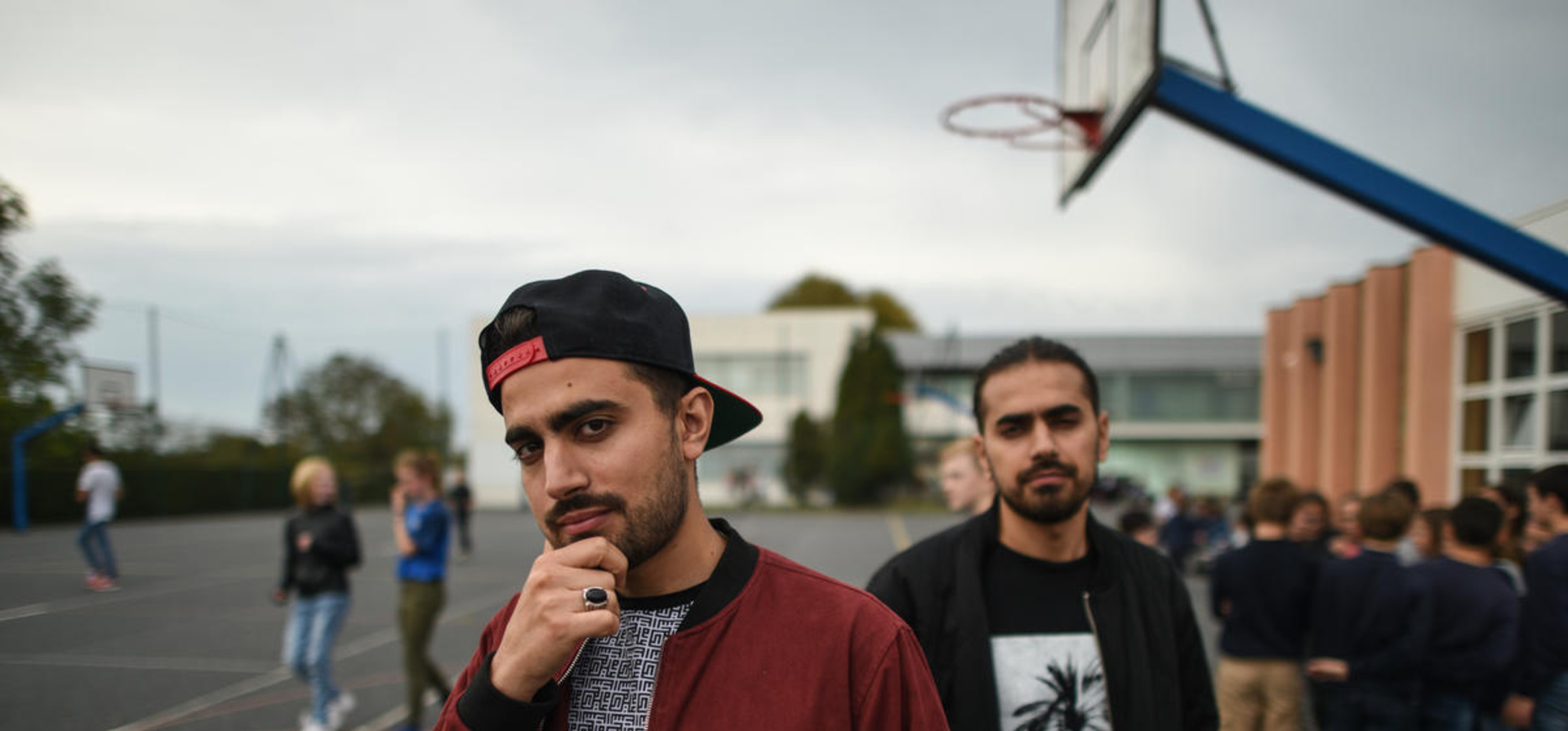 France. Schoolchildren bond with refugee chefs and rappers