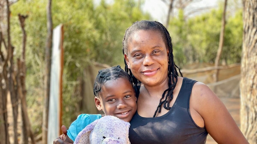 Botswana. Refugees receive donations of new clothing from UNIQLO.