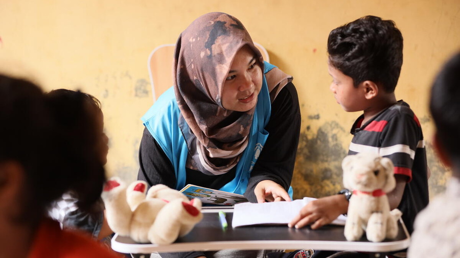 Indonesia. Rohingya children are learning together in the camp.