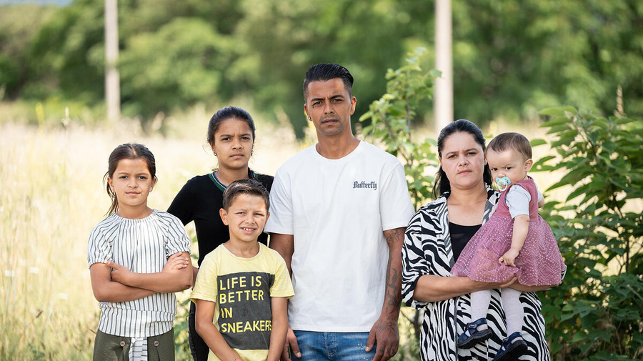 A family of six pictured outdoors
