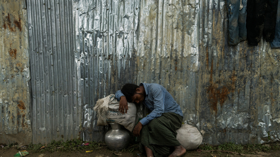 Bangladesh. Rohingya refugees rest on the side fo the road