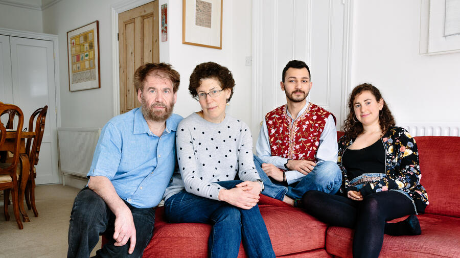 United Kingdom. Simon and Shoshana Goldhill are hosting 21-year-old Faraj, a devout Muslim who attends the mosque every Friday and goes to the synagogue with the family on Saturdays in Cambridge. This portrait is part of Great British Welcome, the UK chapter of the ongoing No Stranger Place series,