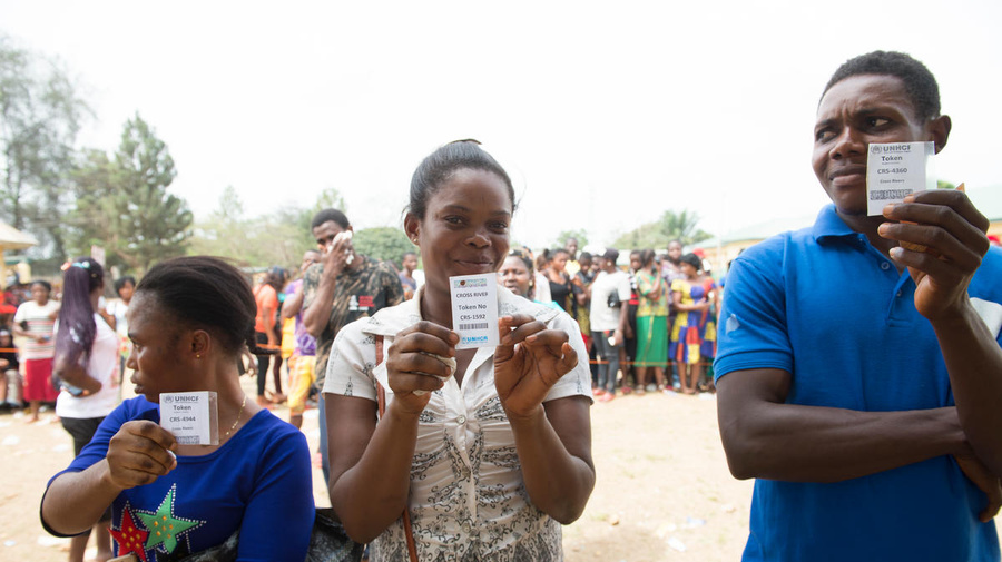 Nigeria. Cameroonian refugees wait to be verifed with their food tokens for relief materials and food distribution in Ikom