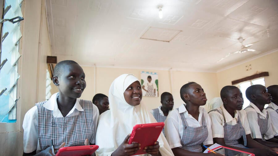 Kenya. Mary and Mumina use tablets in Class 8 at Angelina Jolie School