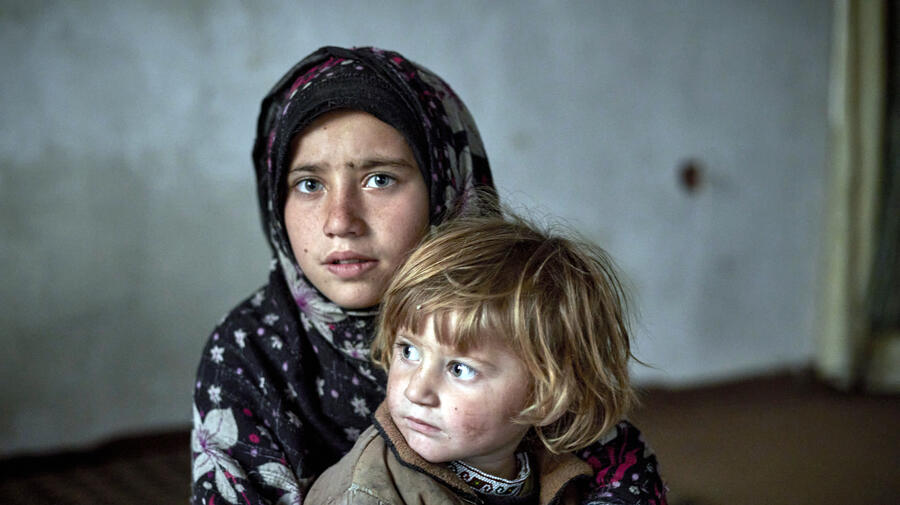 Nine-year-old Fauzia* and her three-year-old sister Aseela* in their temporary accommodation in Kabul. *Names have been changed.