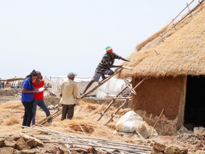 Sudan. Refugee civil engineers supervise shelter construction