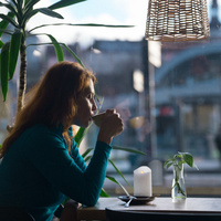 A person drinking from a cup