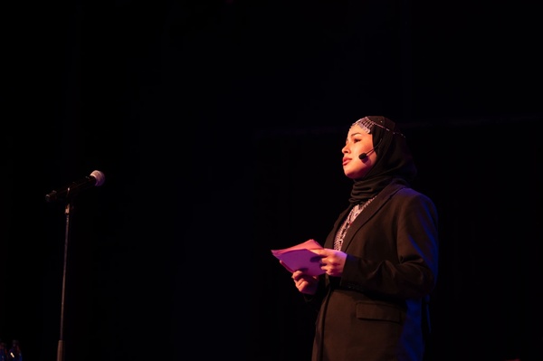 Hamida, from Afghanistan, shares her story on the Maxim Theatre stage about fleeing, and her journey through Iran until she arrived in Sweden where she is now at university ©Ivanna Stytsun