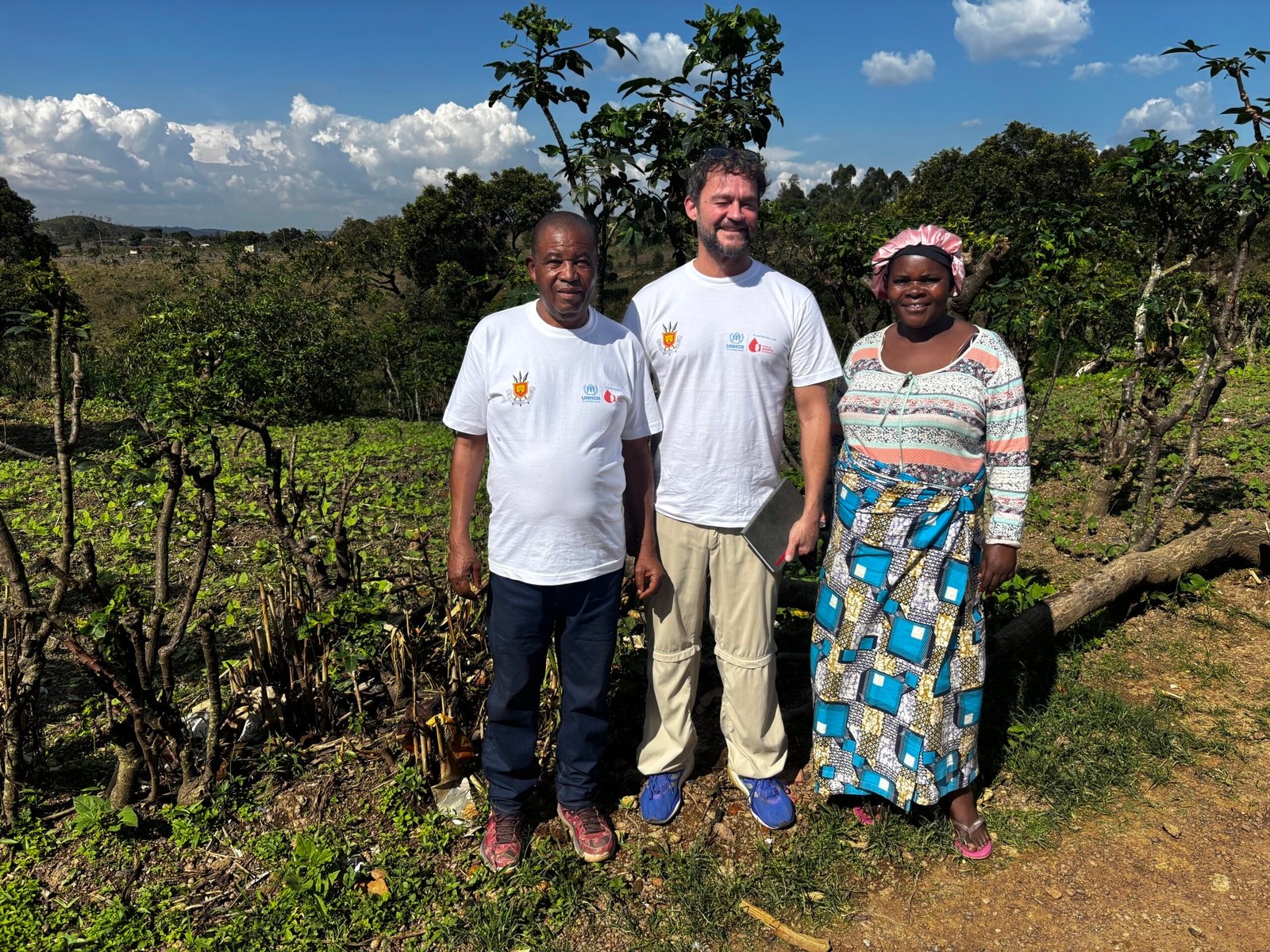 A group of people standing in a field