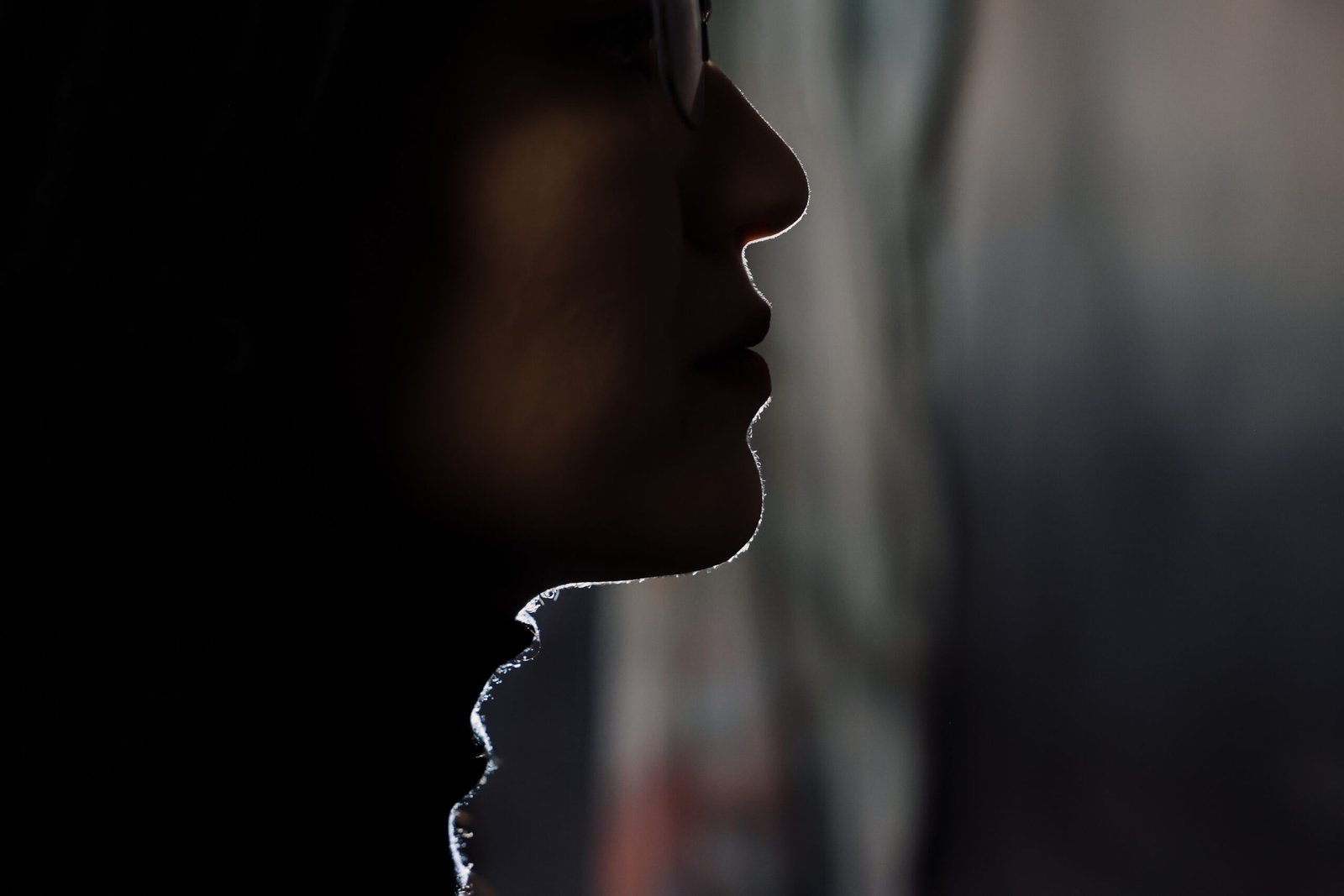 A profile of a person wearing glasses