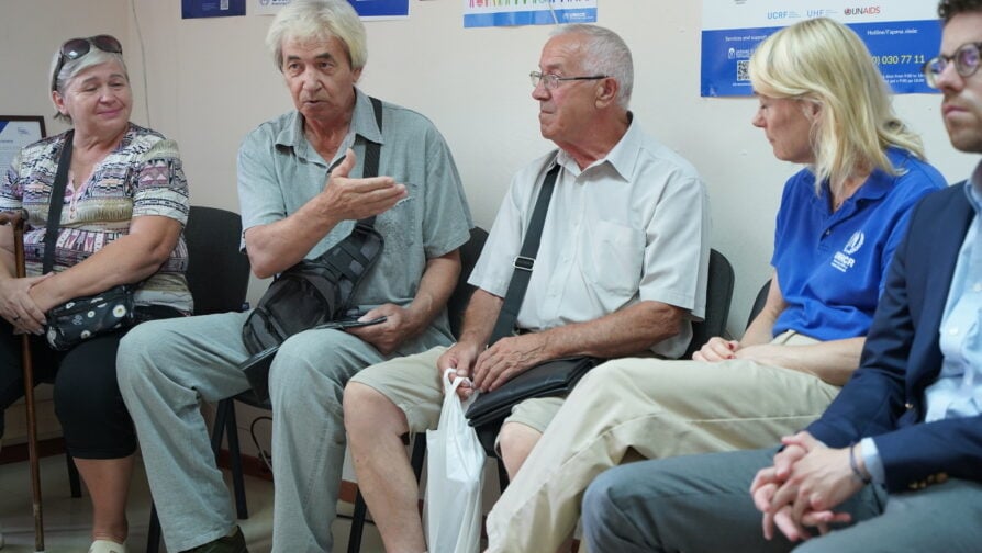 A group of people sitting in chairs