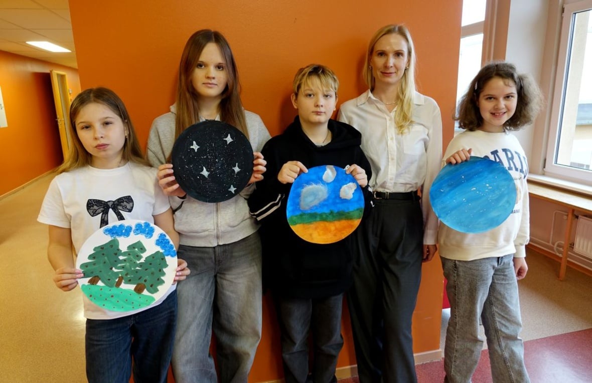 In a classroom at Laagna Gymnasium in Tallinn, Nastya, Dasha, Sasha, and David