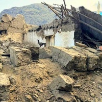 Staff from UNHCR partner ARWEO assess the damage in Mazar Dara village, Kunar province, after the earthquake that struck on 31 August. 