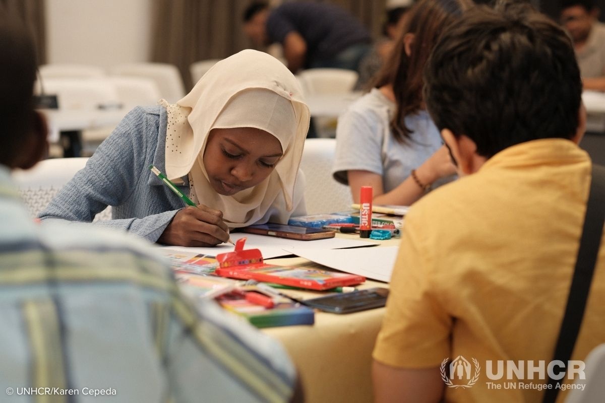 A participant concentrates on her artwork