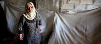 Burning trash to keep warm in Syria town cut off by war
