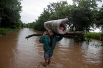 Twin scourges COVID-19 and climate change threaten world’s displaced and stateless