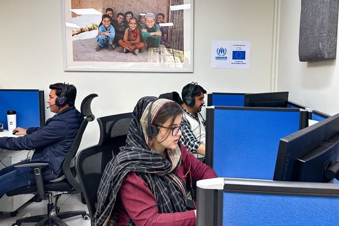 Sumaiya, UNHCR Helpline agent receiving calls from Afghan refugees. 